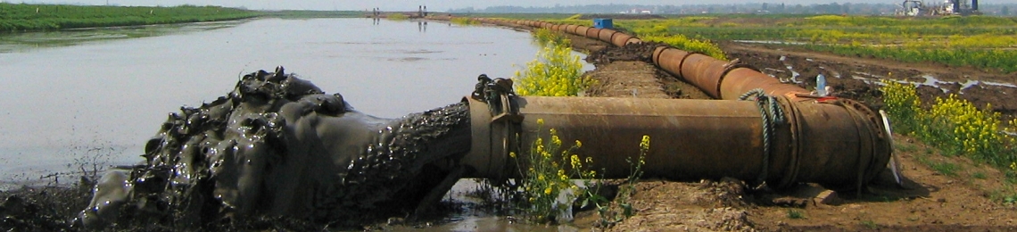 Dredged sediment being pumped into a new location